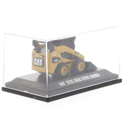 A miniature yellow and black CAT 272C skid steer loader model, displayed inside a clear plastic protective case on a black base with text reading 'CAT 272C SKID STEER LOADER'.