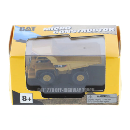 CAT Micro Constructor CAT 770 Off-Roadway Truck toy in its original yellow and black packaging, showing the toy truck through a clear plastic window.