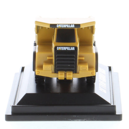 Mini Model of a Caterpillar 770 Off-Highway Haul Truck on a Black Display Base on a White Background