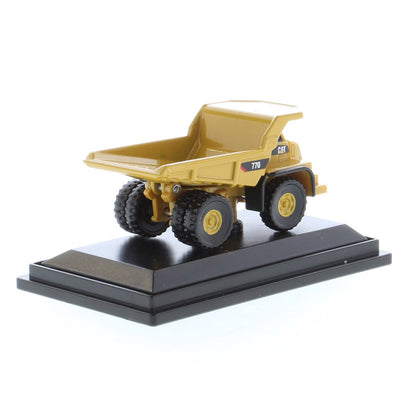 Mini Model of a Caterpillar 770 Off-Highway Haul Truck on a Black Display Base on a White Background