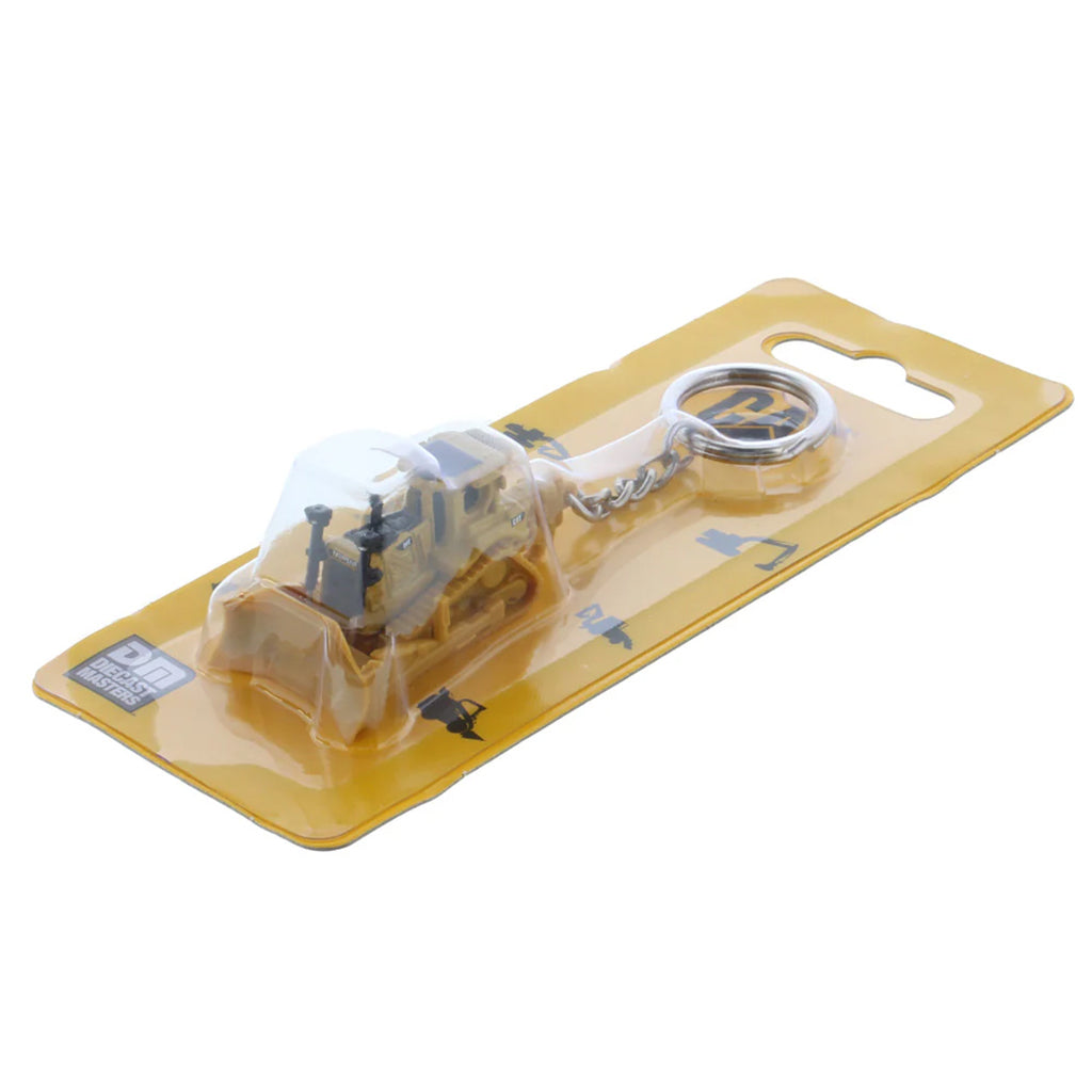 Keychain with bulldozer design on a clear plastic card with yellow border
