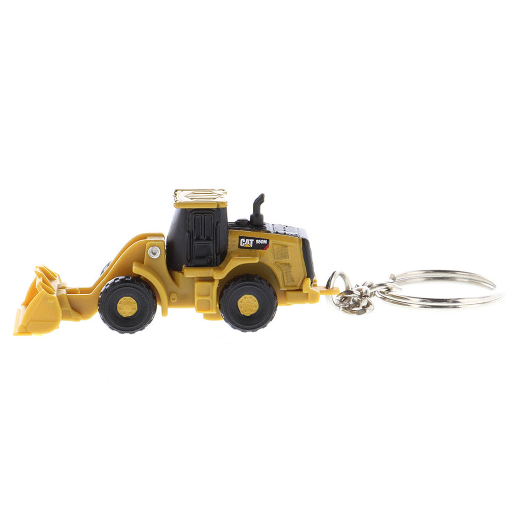 A miniature yellow and black toy wheel loader keychain with a metal key ring attached, shown on a plain white background.