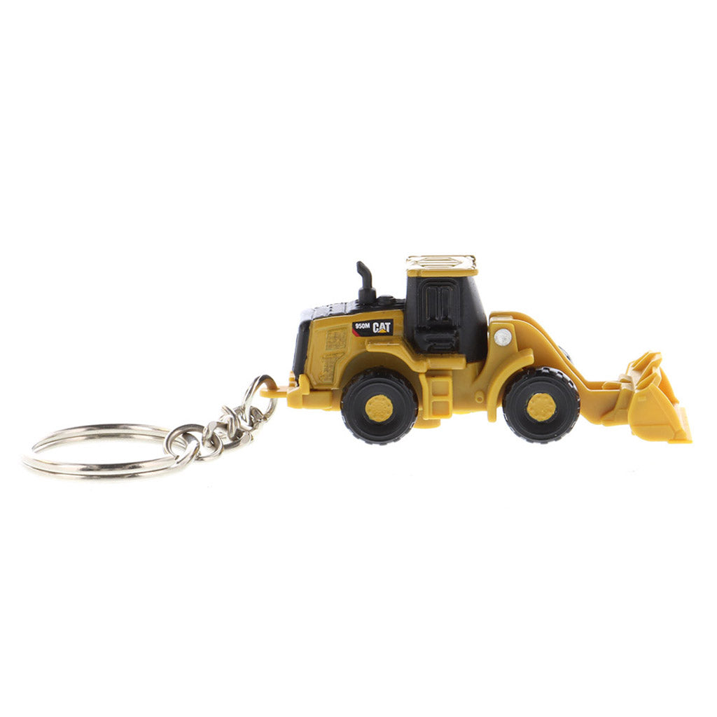 A miniature yellow and black toy wheel loader keychain with a metal key ring attached, shown on a plain white background.