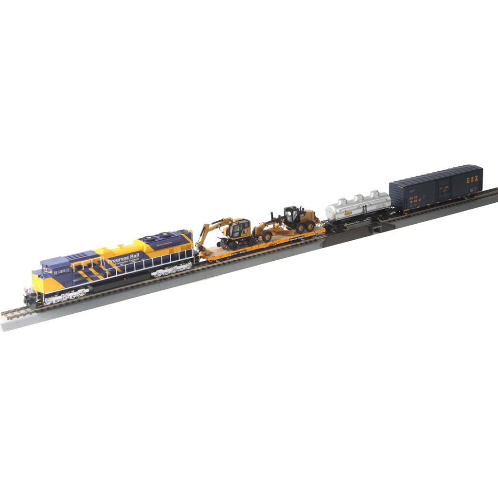 Model train set with locomotive and cargo cars on a track