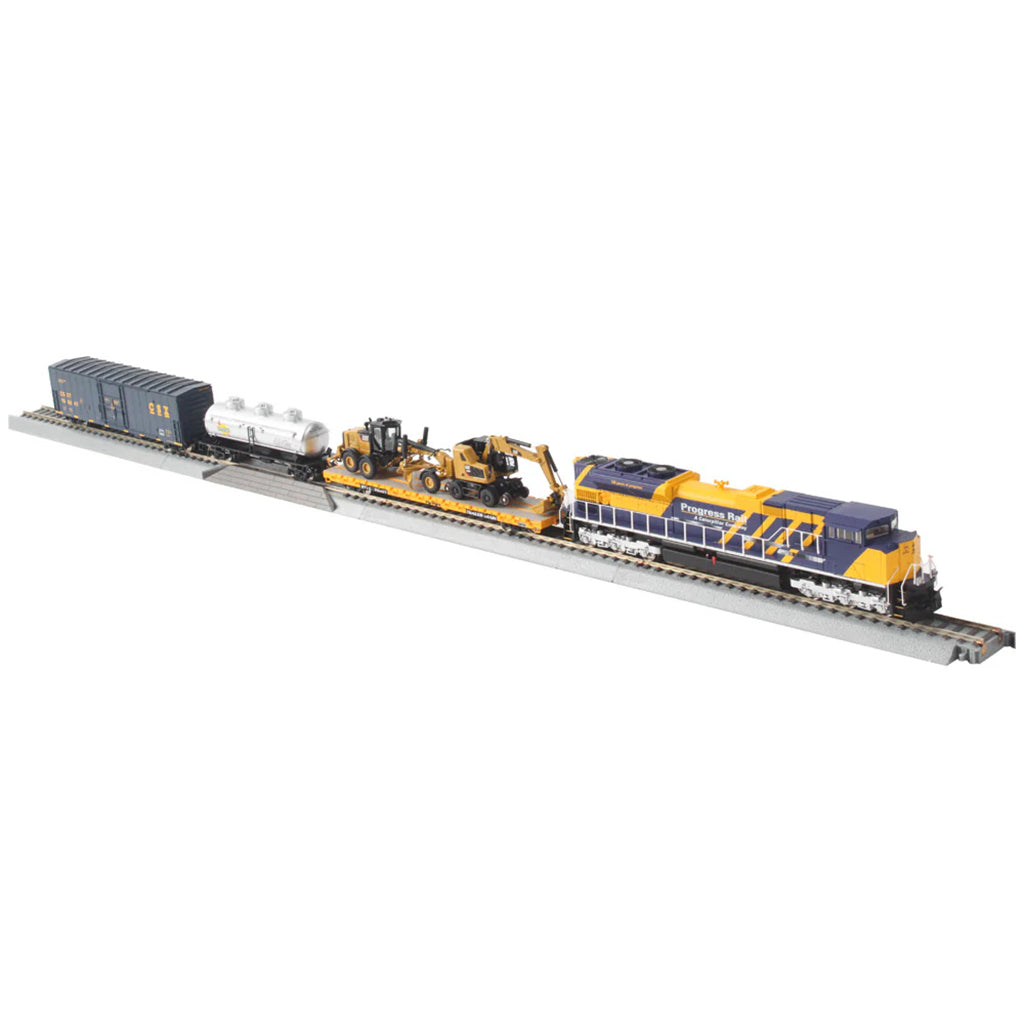 Model train set with locomotive and cars on a track