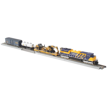 Model train set with locomotive and cars on a track