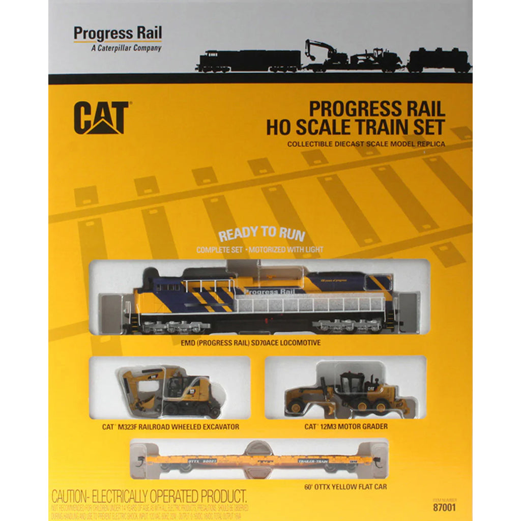 Packaging of Progress Rail HO scale train set with Caterpillar logo on a yellow background
