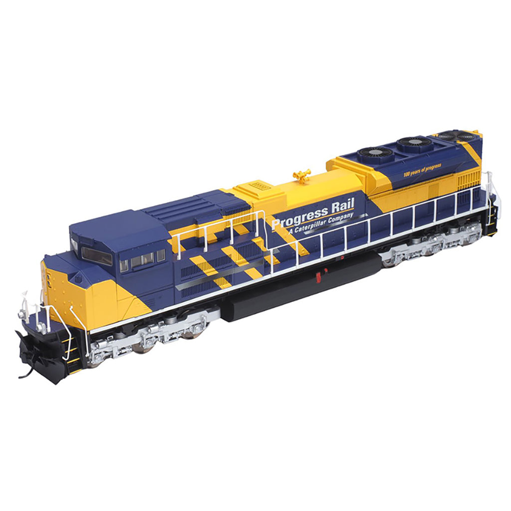 Model train engine with blue and yellow design on a white background