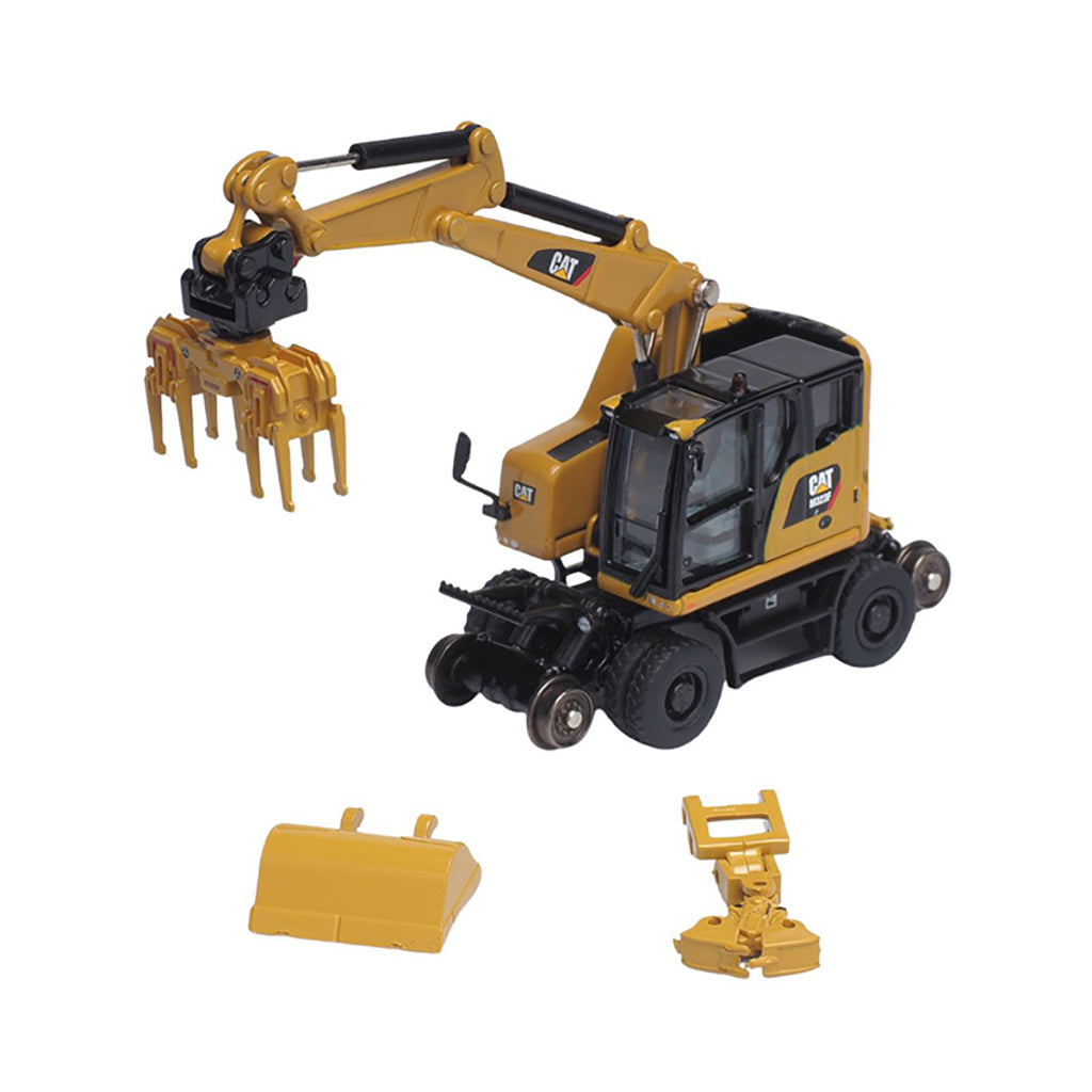 Toy excavator with attachments on a white background
