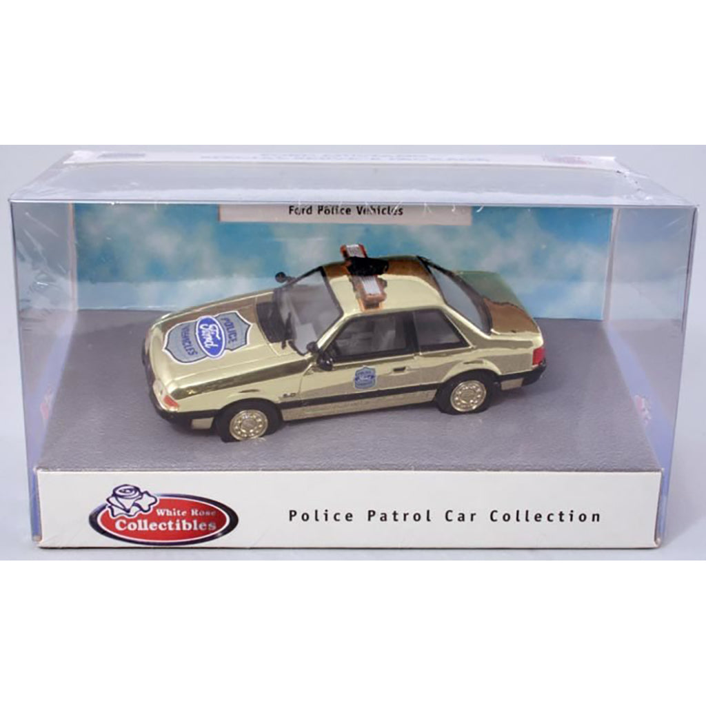 Model police car in a display box with 'White Horse Collectibles' branding.