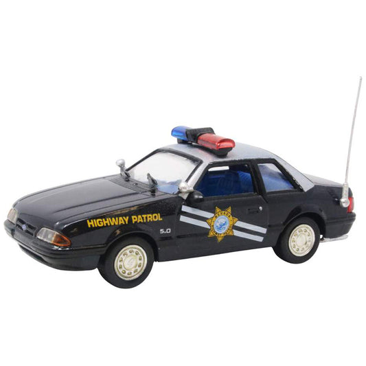 Model of a highway patrol car with lights on a white background