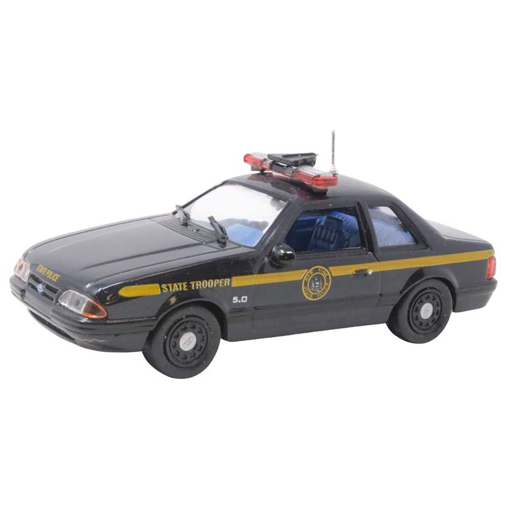 Model police car with 'State Trooper' markings on a white background