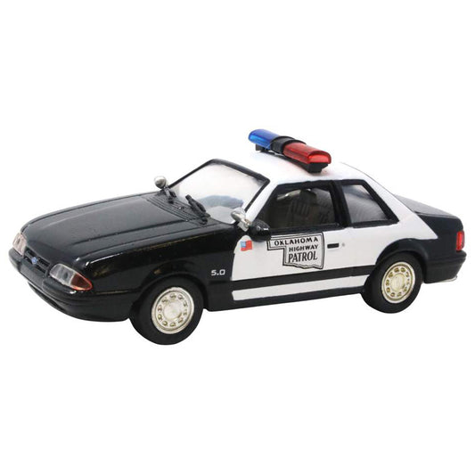 Model of an Oklahoma Highway Patrol police car on a white background