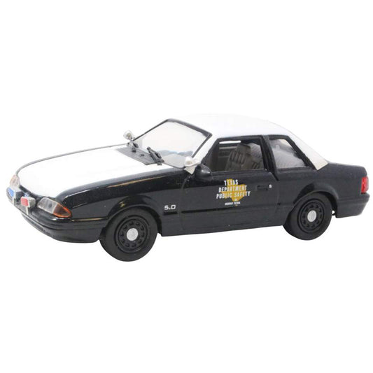 Model police car with 'Texas Department of Public Safety' text on a white background