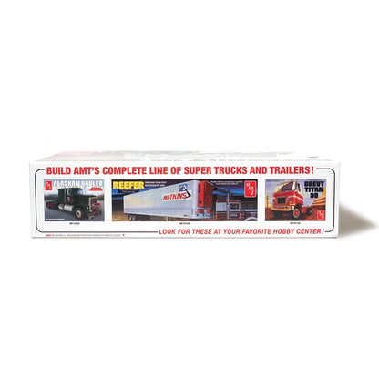 Box of model truck kits featuring different truck designs on a white background.