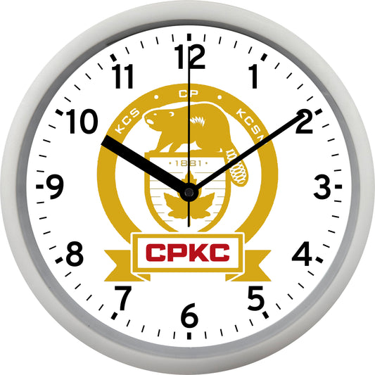 Wall clock with CPKC logo on a white background