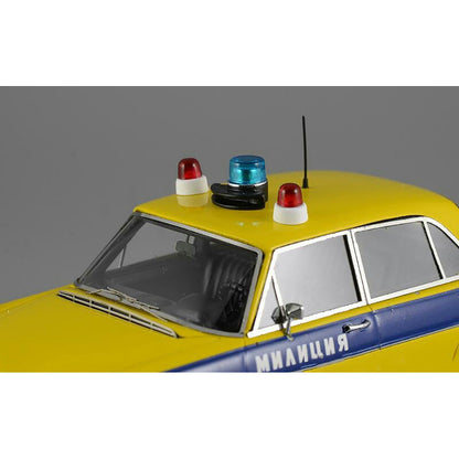 A 1975 Mercedes-Benz W108 'Moscow Police' model car in yellow, blue, and white colors with black wheels and interior.