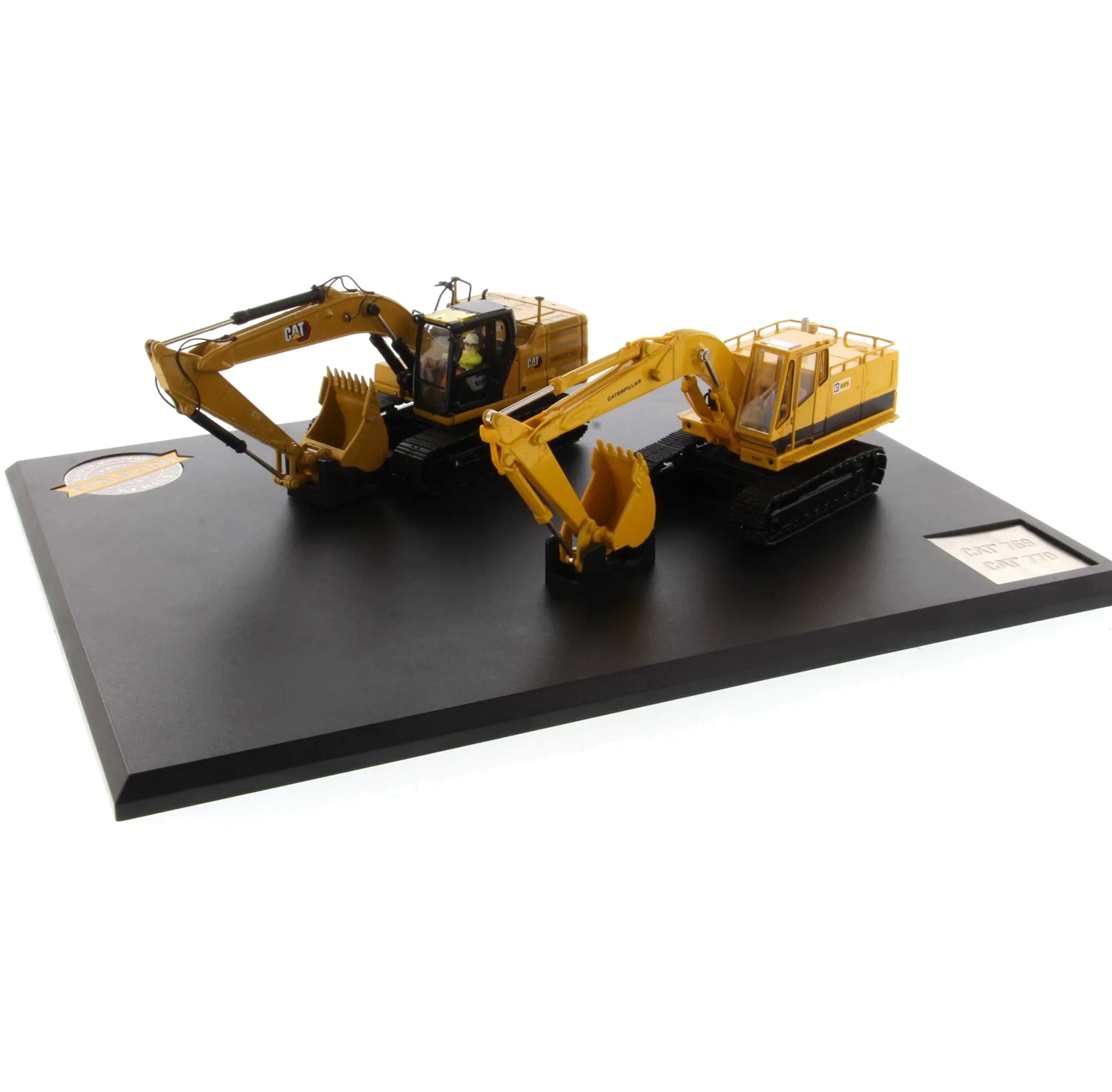 Model of a yellow excavator on a black platform with a white background