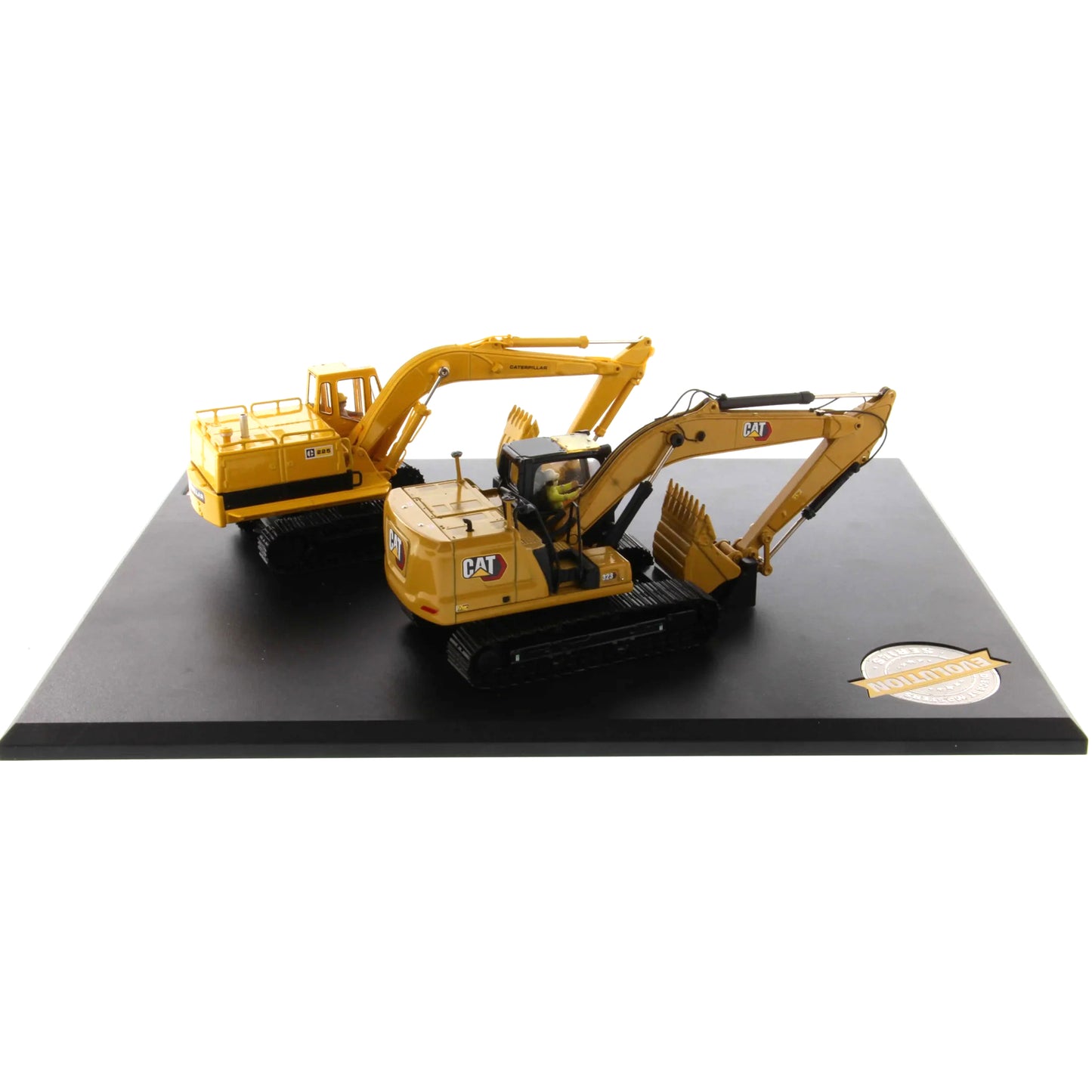 Model of a yellow excavator on a black platform with a white background