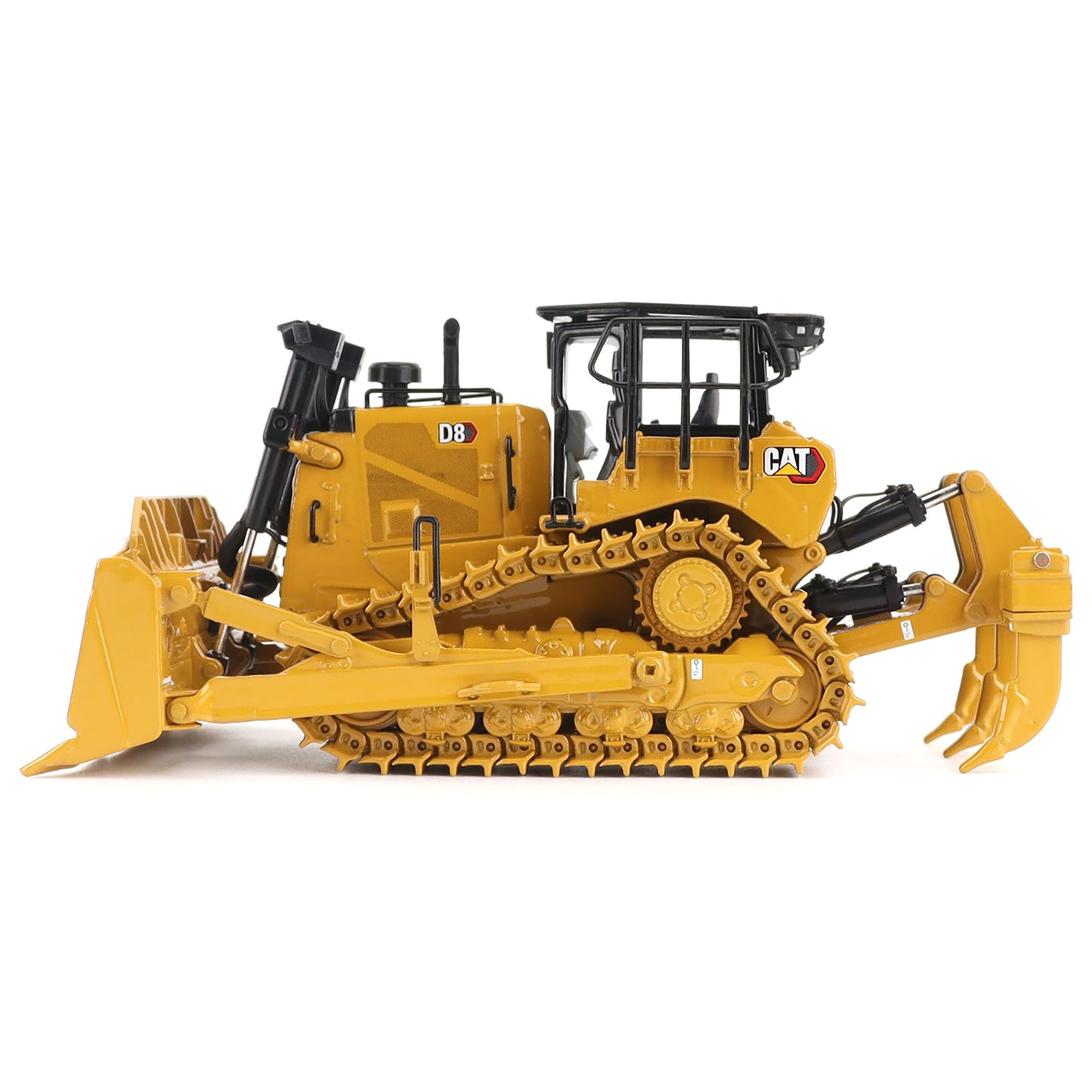 Yellow toy bulldozer with black details on a white background
