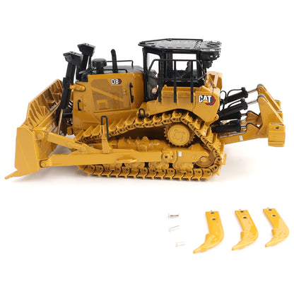 Toy bulldozer with attachments on a white background