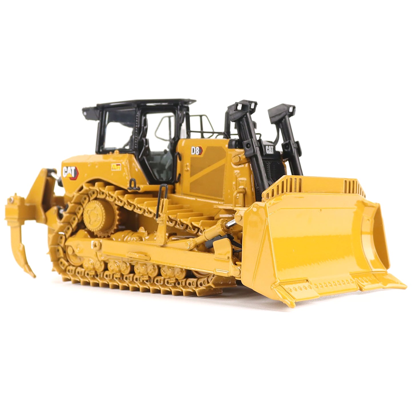 Yellow construction bulldozer toy on a white background