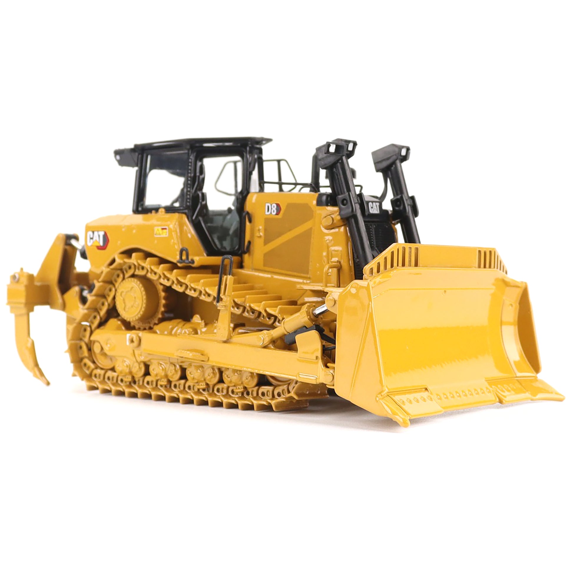 Yellow construction bulldozer toy on a white background