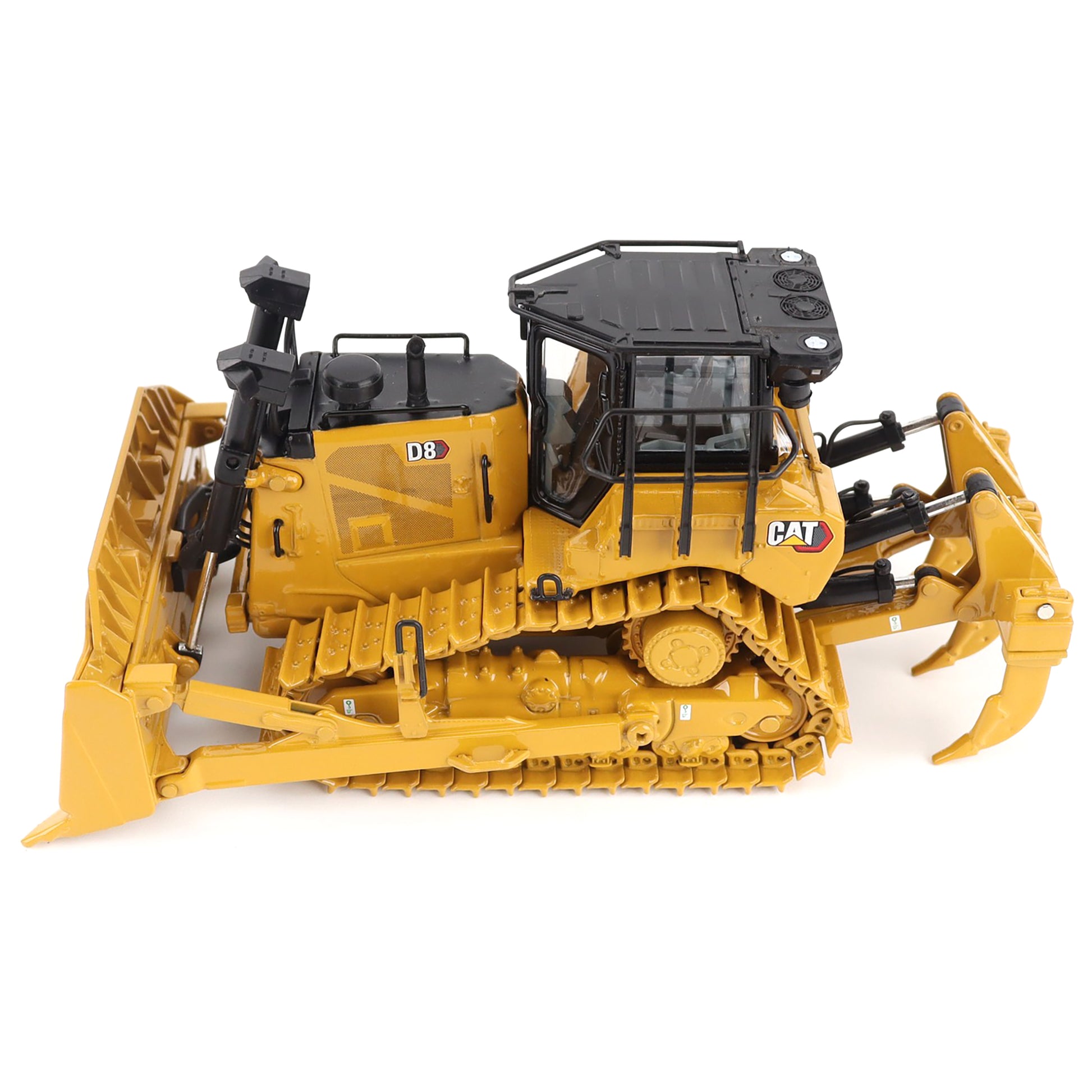 Yellow toy bulldozer with black details on a white background