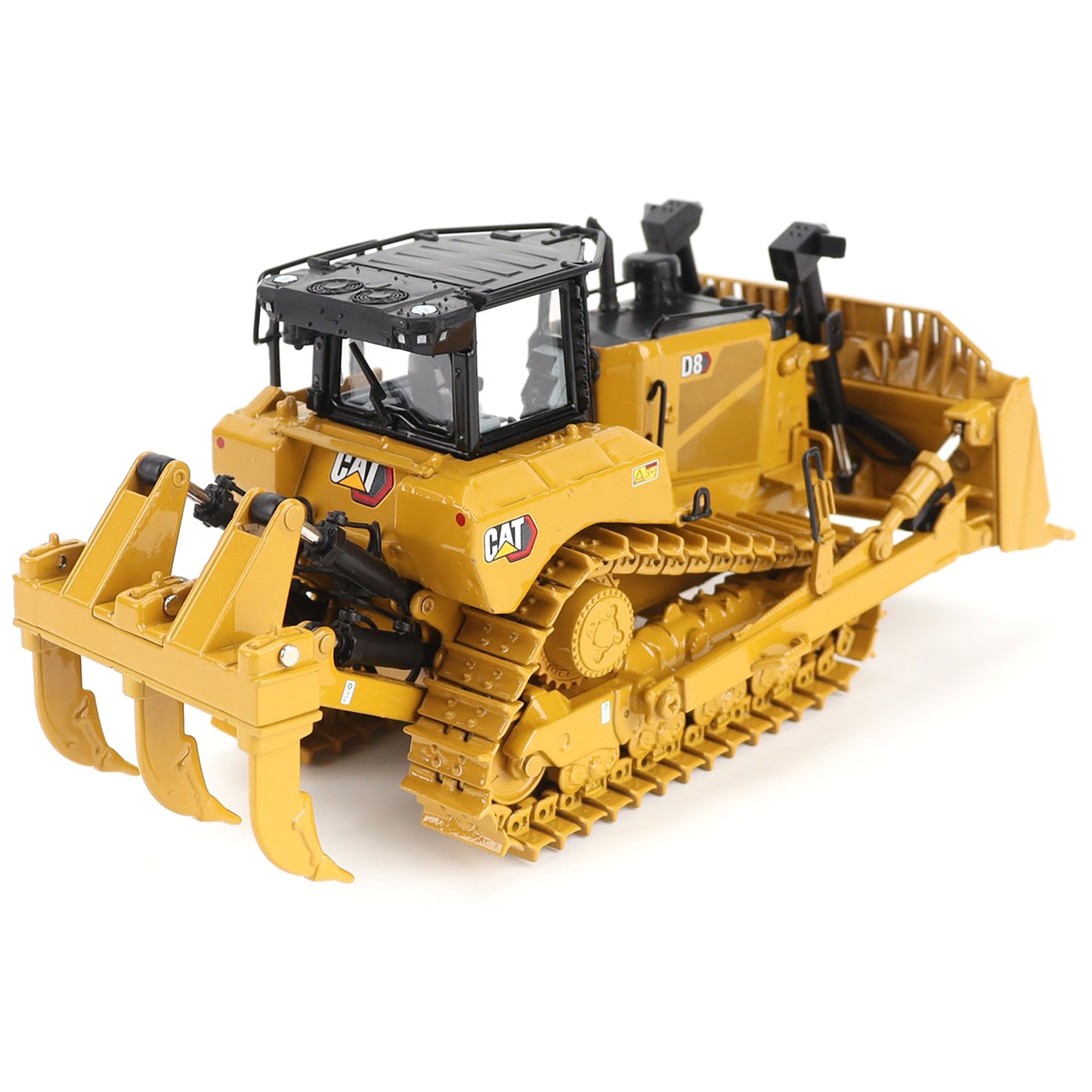Yellow toy bulldozer with detailed features on a white background
