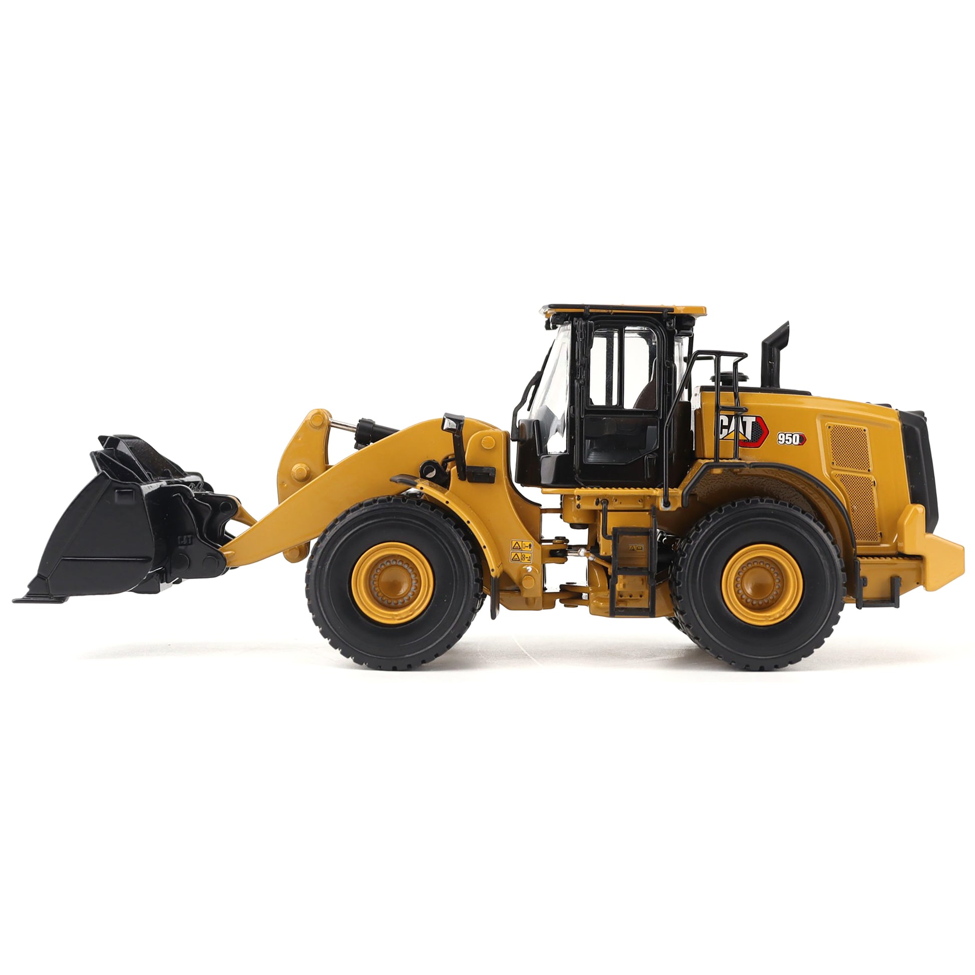 Yellow toy wheel loader on a white background