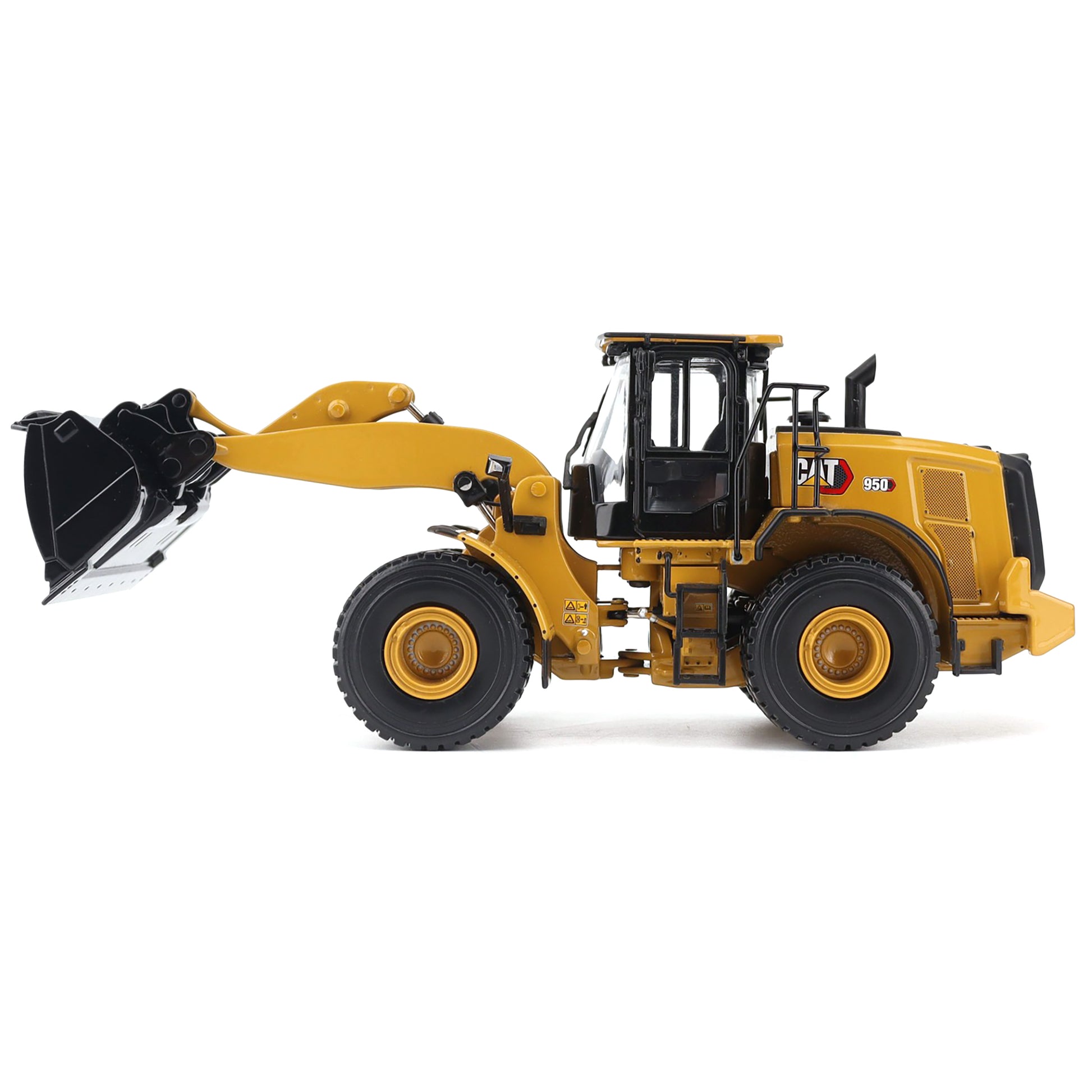 Yellow toy wheel loader with black attachments on a white background