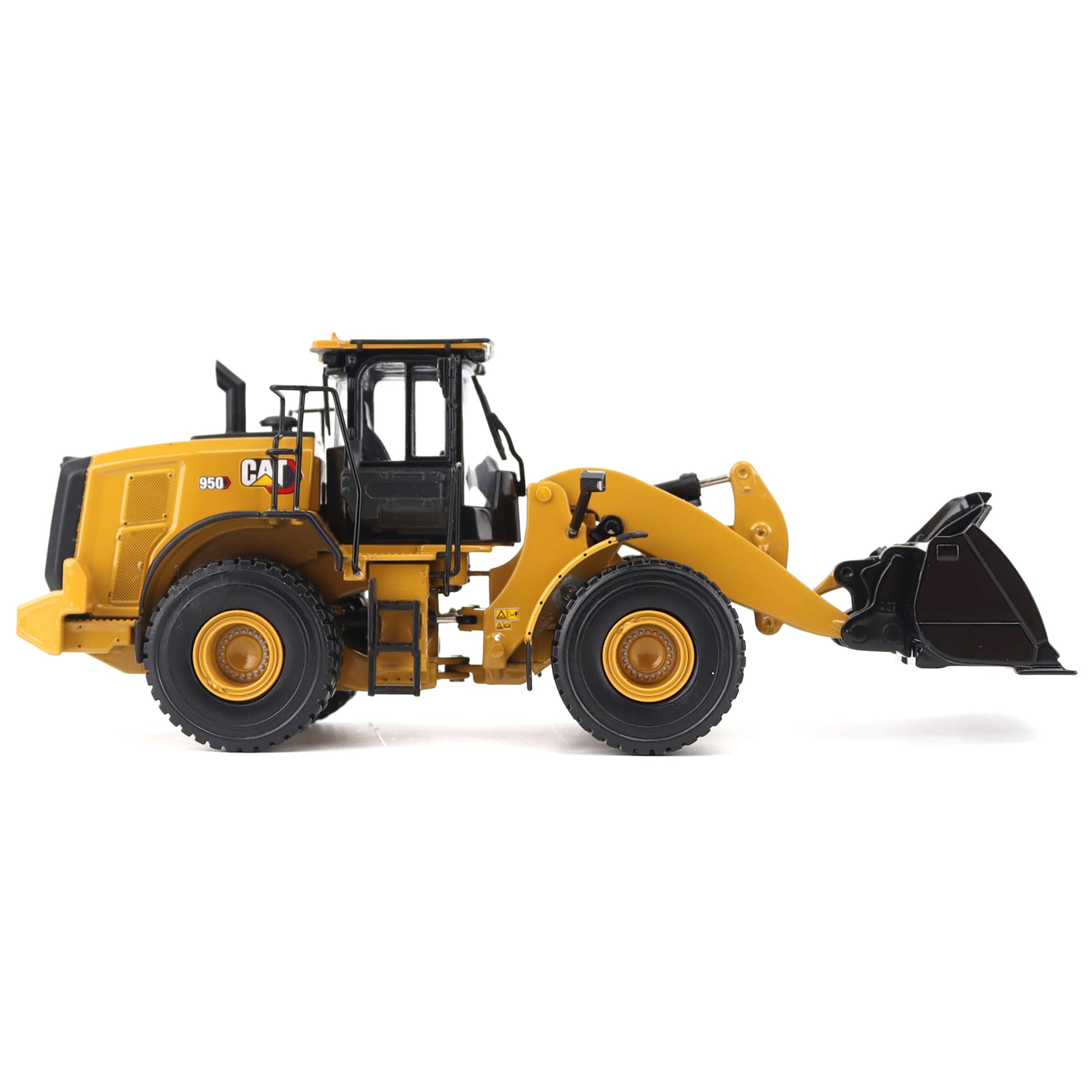 Yellow toy wheel loader with black attachments on a white background