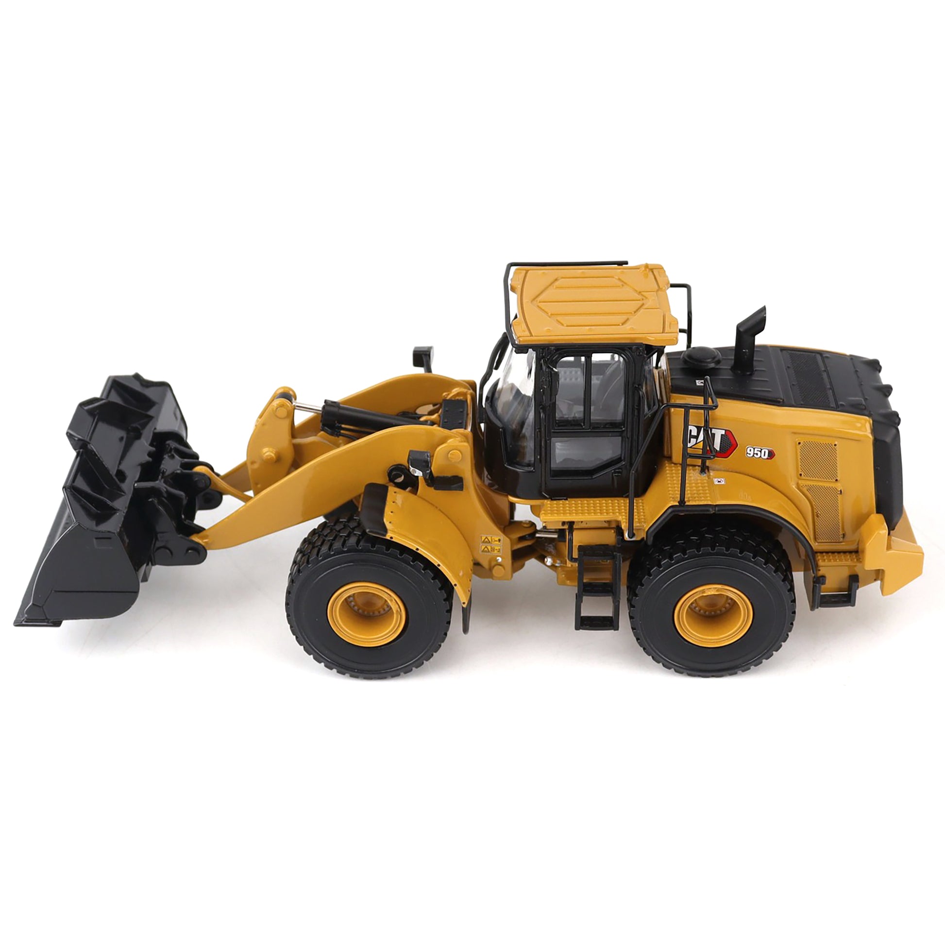 Model of a yellow front loader with black attachments on a white background