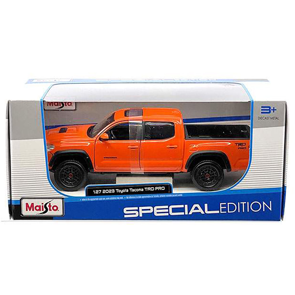 Maisto Special Edition Toyota Tacoma toy truck packaging with an orange toy truck on a white background