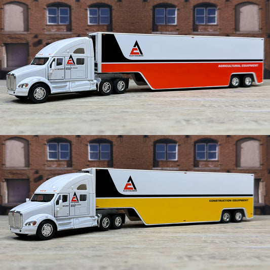 Two model trucks with different colored trailers in front of a brick building.