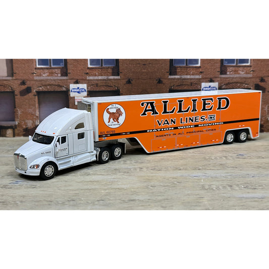 Model truck with 'Allied Van Lines' branding in front of a brick building.