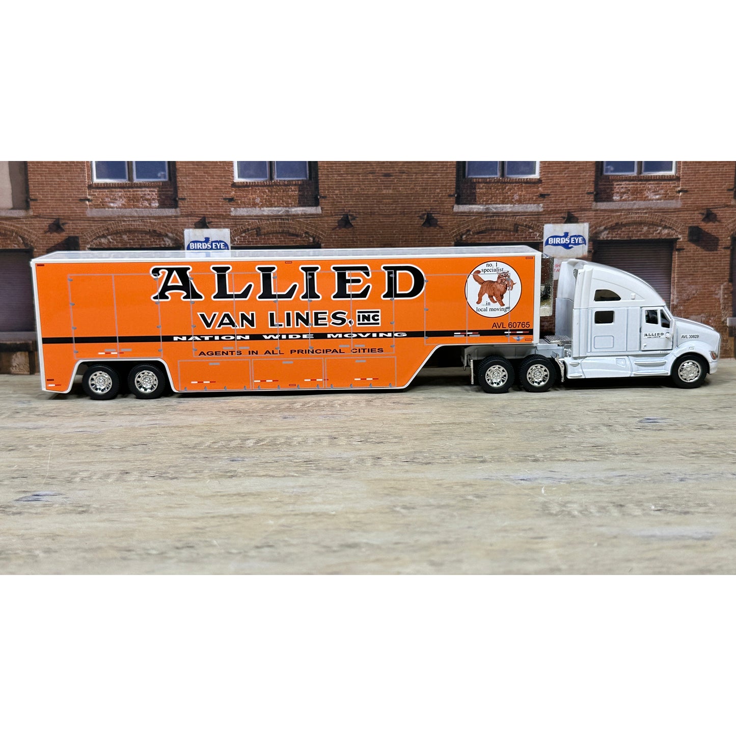 Model truck with 'Allied Van Lines, Inc.' branding on an orange trailer.