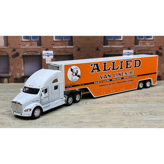 Model truck with 'Allied Van Lines' branding in front of a brick building.