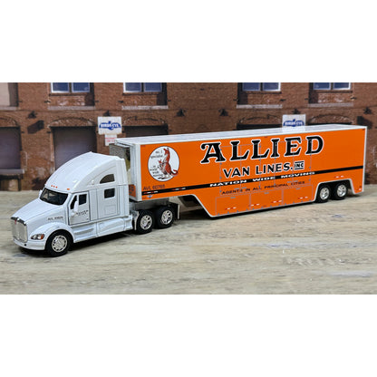 Model truck with 'Allied Van Lines' trailer in front of a brick building.