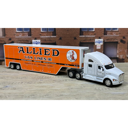 Model truck with 'Allied Van Lines, Inc.' branding in front of a brick building.