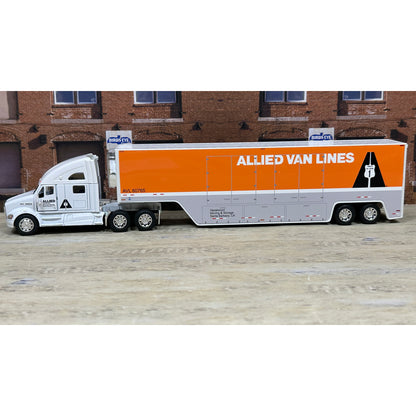 Model of an Allied Van Lines truck in front of a brick building.