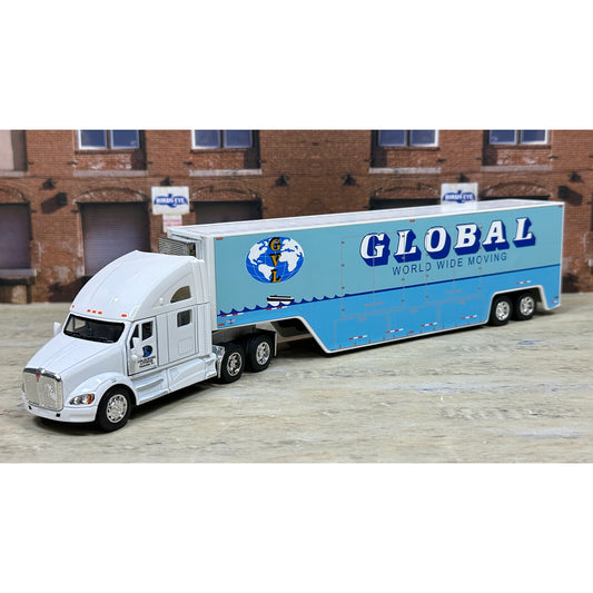 Model of a white truck with a blue trailer labeled 'Global World Wide Moving' in front of a brick building.