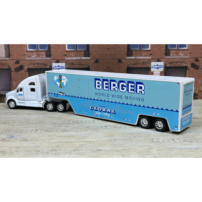 Model of a Berger world wide moving truck in front of a brick building.