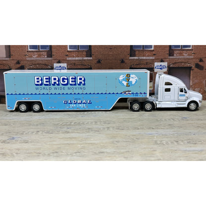 Model truck with 'Berger World Wide Moving' branding on a wooden surface.