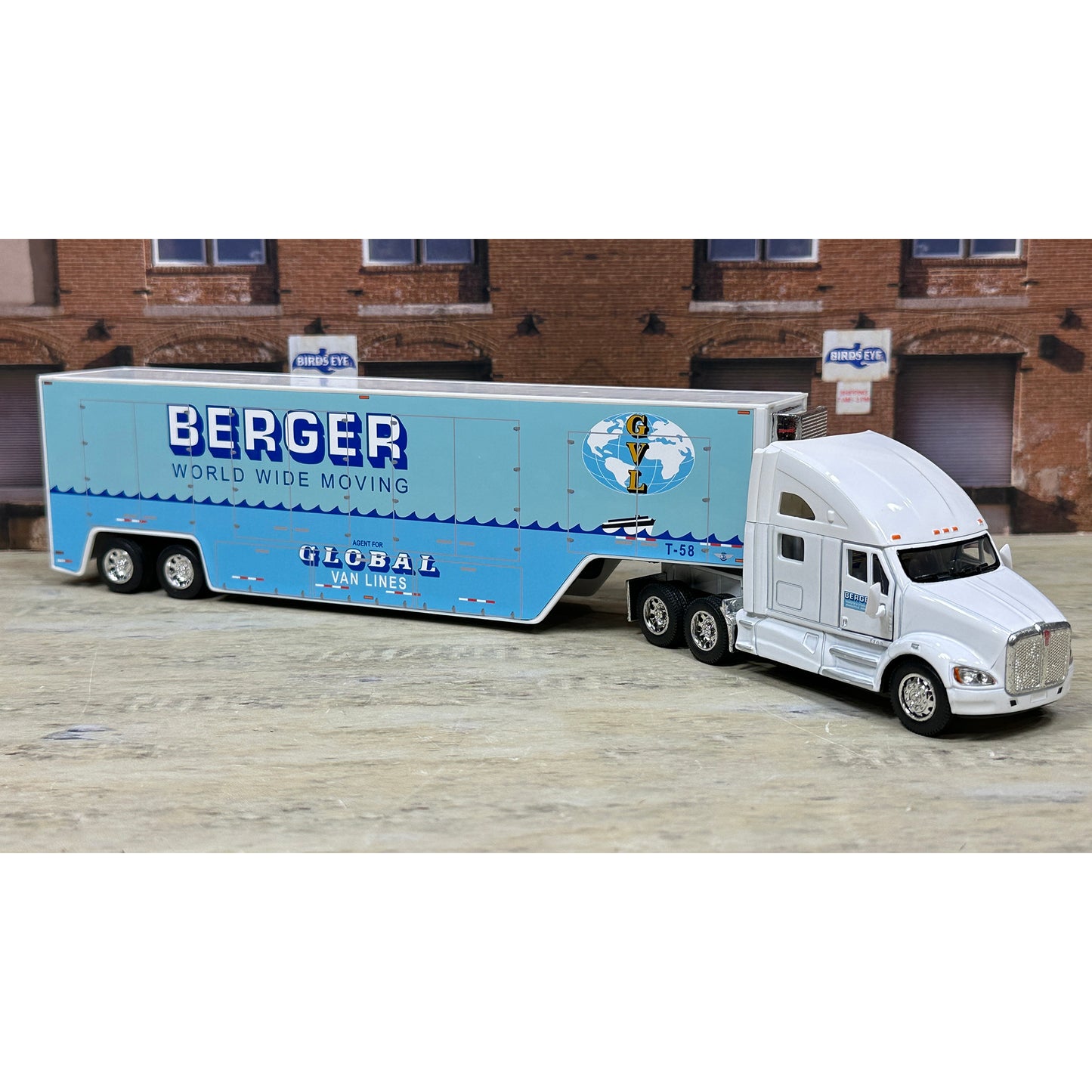 Model truck with a blue trailer labeled 'Berger World Wide Moving' on a white background