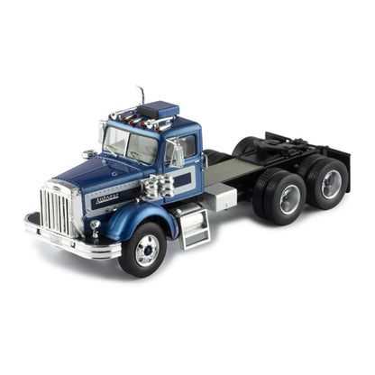 Model of a blue and silver Autocar truck on a white background