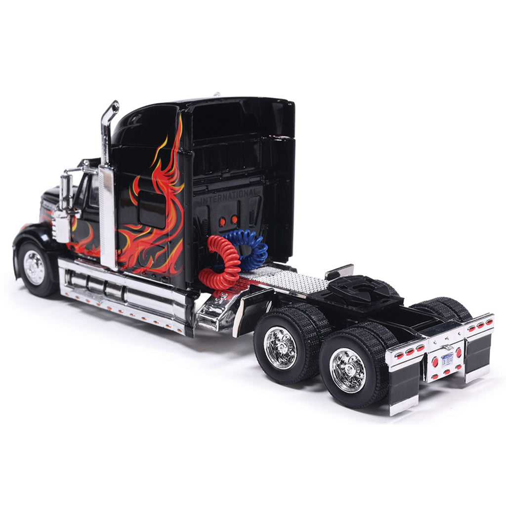Model of a black truck with red and blue flame design on a white background